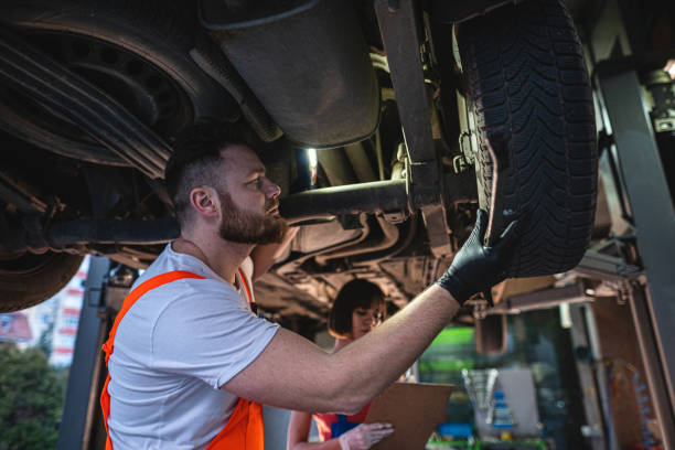 istock Automobile safety engineer examining a car 1211850130