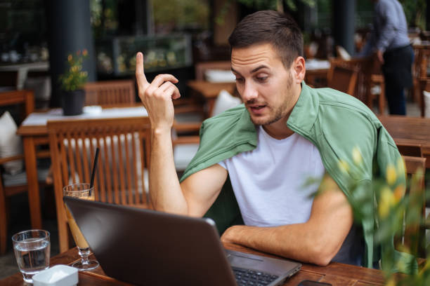 istock Young man talking to his colleague via video call 1211851023