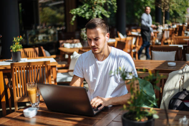 istock Student surfing the net in a cafe 1211851029