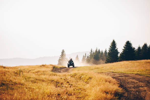 istock Couple riding on a quad bike 1211851083