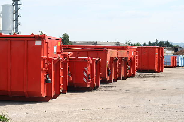 istock Line of red shipping containers sitting outside 121185567