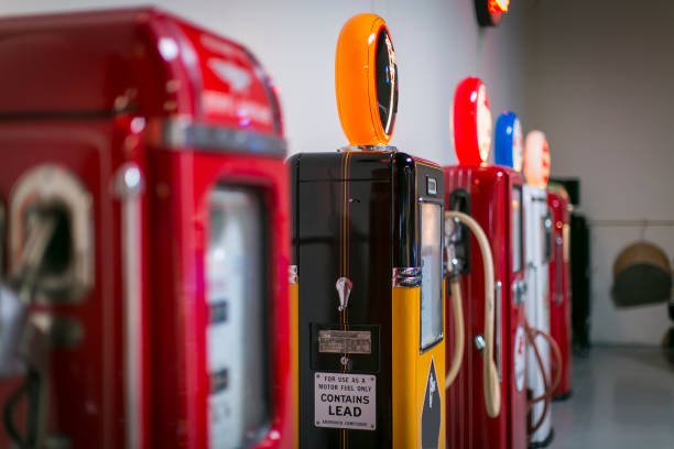 Row of vintange automobile gasoline pumps Colorful vintage gasoline pumps placed in a row vintage gas pumps stock pictures, royalty-free photos & images