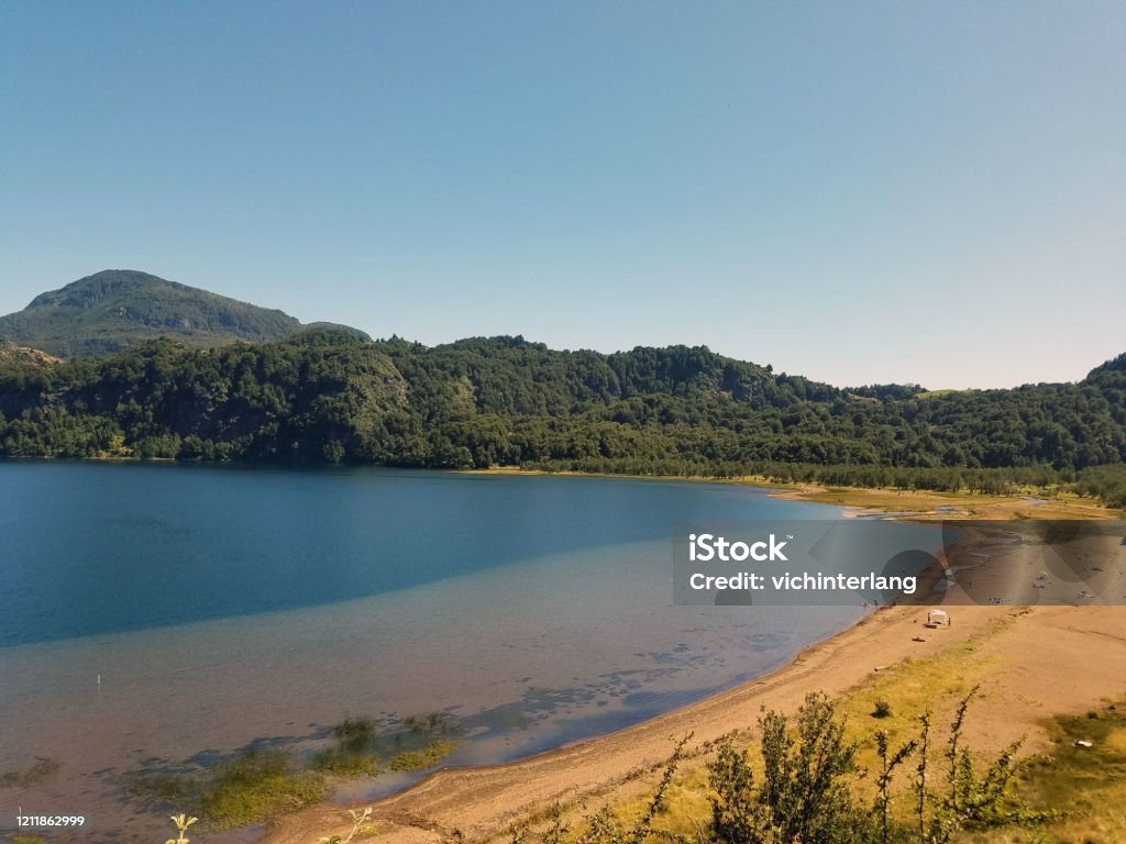 Route of the Six Lagoons, near Coyhaique People enjoy a lake in a valley in the foothills of the Andes Mountains on the Route of Six Lagoons, near Coyhaique. Chile Stock Photo