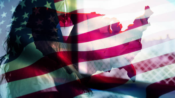istock Coronavirus 2019-nCov novel coronavirus concept motion background, patience with protective mask and USA flag overlay. 1211866072