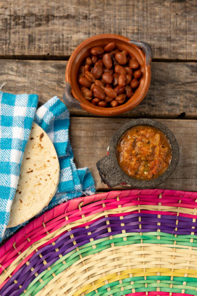 istock mexican bayos beans with molcajete sauce and corn tortillas 1211867100