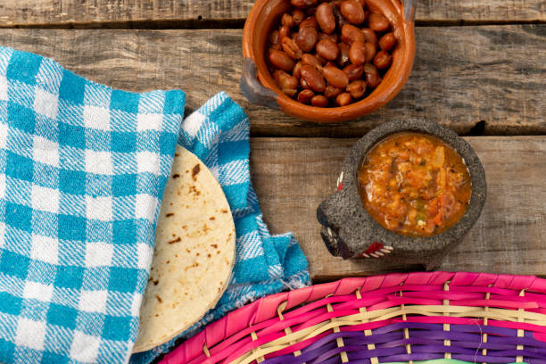 istock mexican bayos beans with molcajete sauce and corn tortillas 1211867186