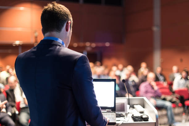 istock Public speaker giving talk at business event. 1211869049