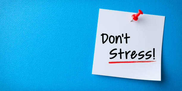istock White Sticky Note With Don't Stress And Red Push Pin On Blue Background 1211869272
