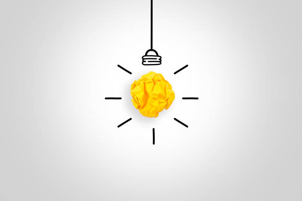 istock Idea Concepts with Light Bulb Crumpled Paper on White Background 1211869391