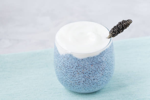 istock Blue chia seed pudding with blackberry in glass 1211870558