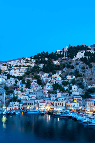 istock View over harbour at dusk Symi Town 1211870873