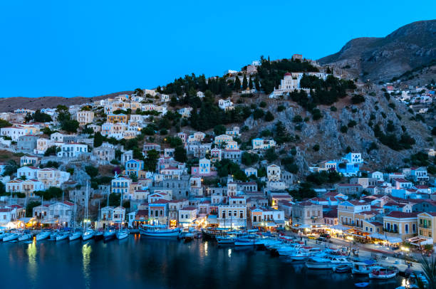 istock View over harbour at dusk Symi Town 1211871992