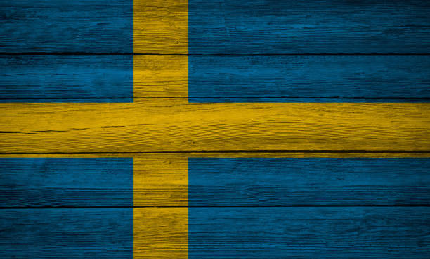 istock Sweden flag wooden plank background 1211872000