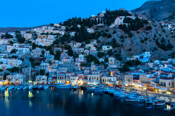 istock View over harbour at dusk Symi Town 1211872031