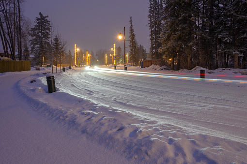 Snowy winter street at dawn in Canmore, Alberta, Canada