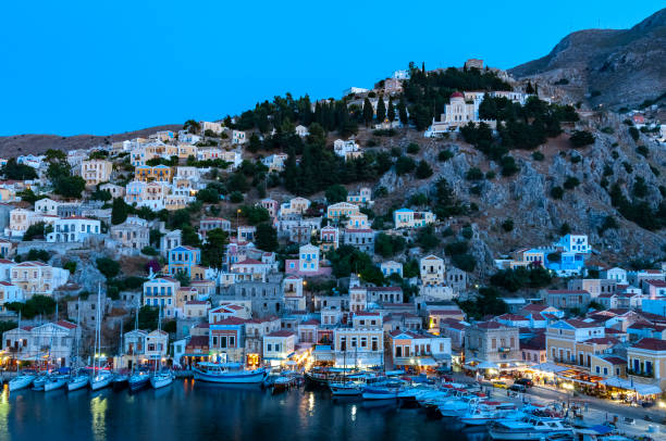 istock View over harbour at dusk Symi Town 1211872063