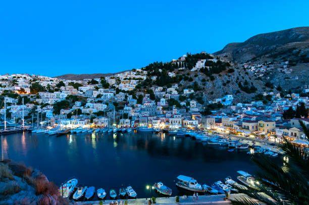 istock View over harbour at dusk Symi Town 1211872067
