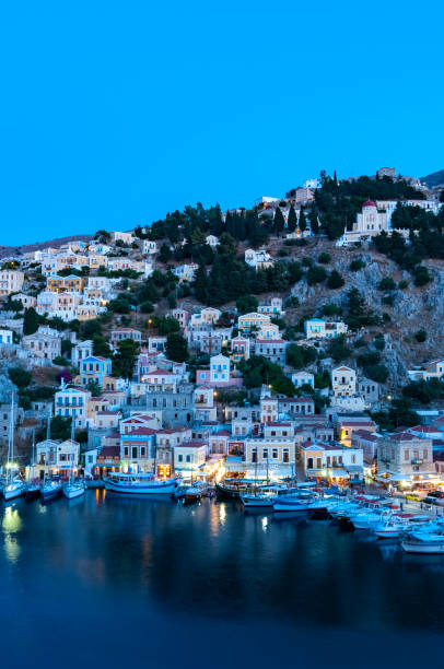 istock View over harbour at dusk Symi Town 1211872393