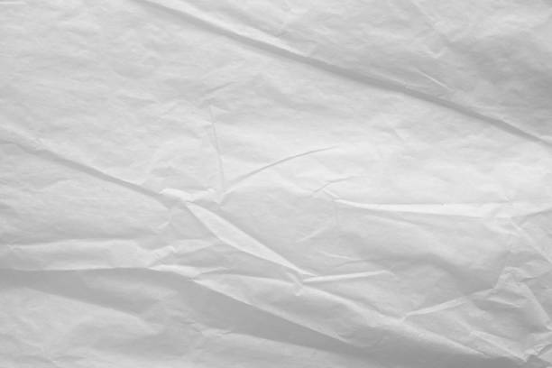 istock White crumpled paper abstract background texture 1211877505