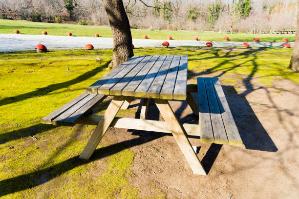 Wooden picnic shelter with red roof on a mountain viewpoint in Divcibare, Serbia. Rest place surrounded by pine forest