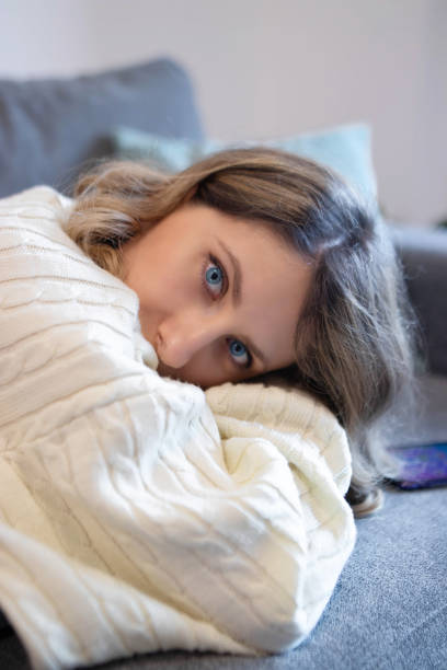 istock Girl lying on a bed 1211878394