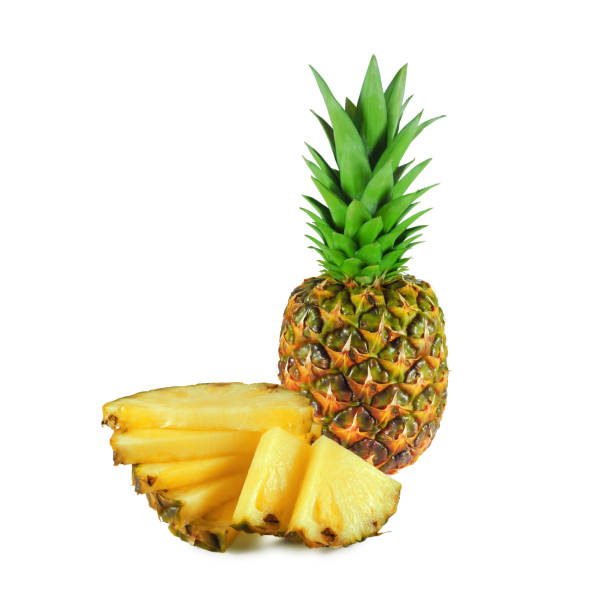 istock Ripe pineapple with slices isolated 1211879251