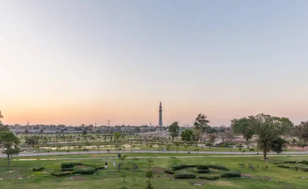 Greater Iqbal Park at sunset, in outskirts of Walled City of Lahore, Pakistan, with Minar-e-Pakistan in the center, a national monument and symbol of independence.