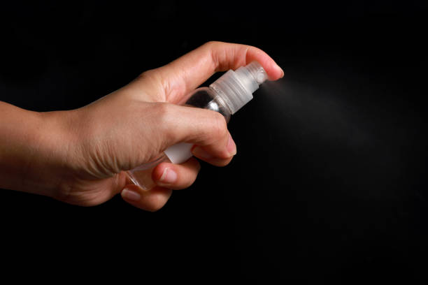 istock Hand of lady that holding alcohol spray or anti bacteria spray 1211891799