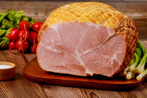 istock Whole ham with radish, scallion and salt. 1211901100