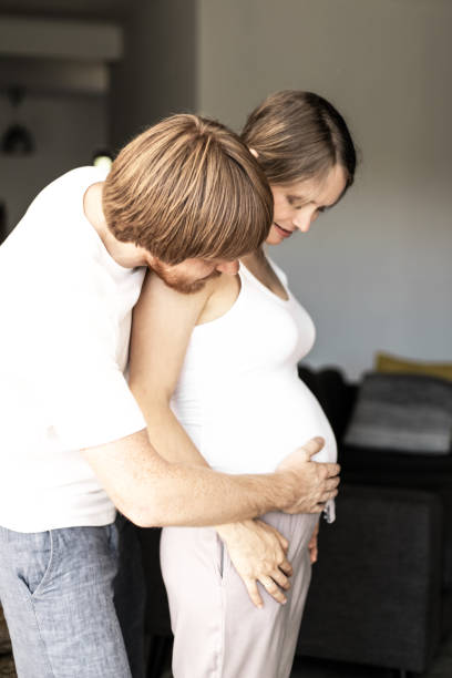 istock Expectant couple at home 1211909175