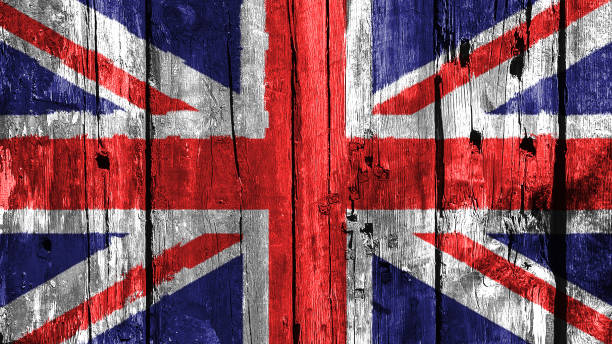 istock British UK england flag on worn old wood flag 1211920272