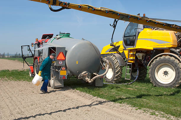 istock Pouring Chemical for machinery sprayer 121192086