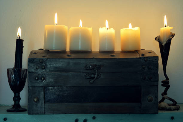 Ritual wooden box with burning candles. Esoteric, wicca and occult background, fortune telling and divination ritual, mystic concept