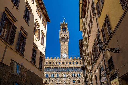Florence, Italy - September 05, 2019: Palazzo Vecchio, the town hall of Florence City in a sunny summer day.