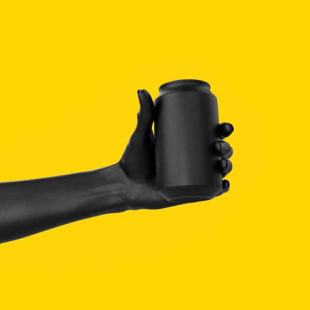 istock Black abstract hand gesture holding black can isolated on yellow backgrounds, display beverage banner mockup, beer advertising creative design concept, 3d rendering 1211925222