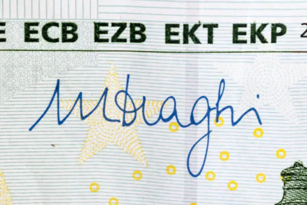 Mario Draghi's signature on 100 Euro banknote. Mario Draghi is president of the European Central Bank.