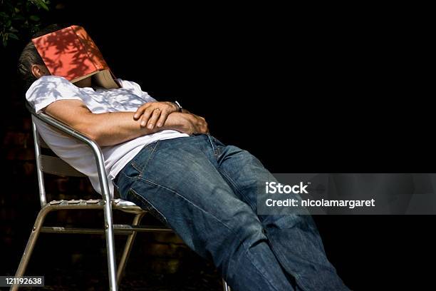 Man With Book On His Head Stock Photo - Download Image Now - Below, Book, Chair