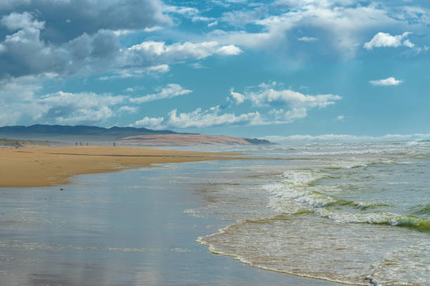 istock Sandy beach and ocean view. Beautiful mountains and cloudy sky on background. Pacific Ocean, California Coast 1211926454