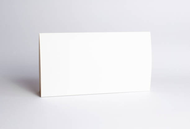 istock Blank black paper corners macro view selective focus on white as template for logo presentation, embossing etc. 1211927192