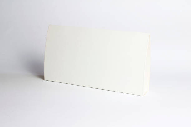 Blank empty paper Table Tent table-tent on white as template for designers design presentation, showcase etc.