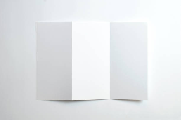 istock Blank opened tri fold brochure isolated on white as template for design presentation, showcase, etc. 1211927264