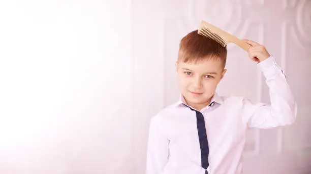 Preteen boy with coms. Child cute portrait. independent kid hygiene. bath elementary routine.