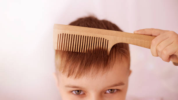 istock Serious view. Wooden comb. Bright interior. Horizontal 1211934477