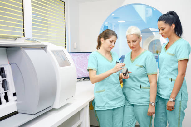 istock Medical research at the lab. Scientist in laboratory working with medical samples  using modern equipment. Laboratory Medical Equipment Medical devices for analyzes. Blood tested for Coronavirus (COVID-19),  Cancer. definition of DNA, virus, 1211935054