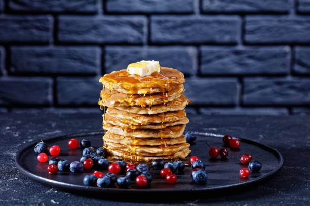 istock oatmeal pancakes served with fresh blueberries and cranberries 1211943562