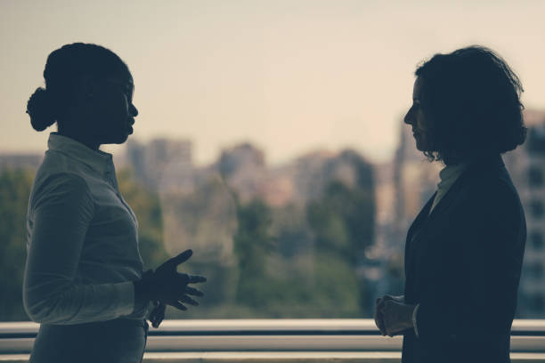 istock Female business colleagues discussing work issues 1211945835
