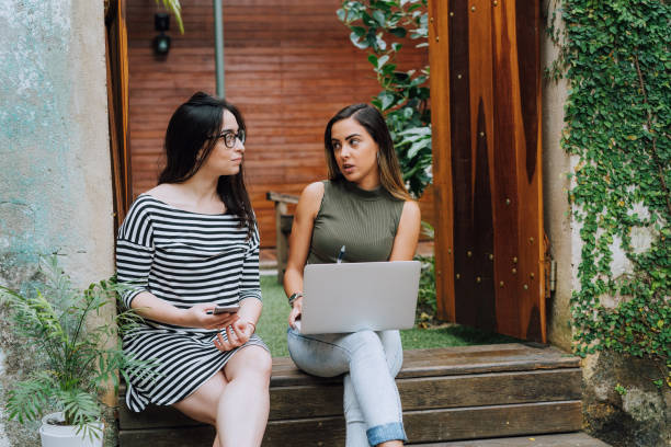 istock young people looking together on laptop 1211945980
