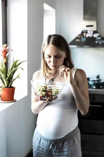 istock Excited expectant mother keeping healthy diet 1211946002