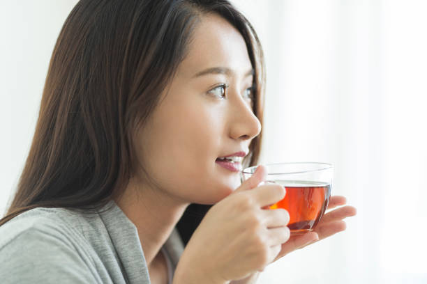 Young woman drinking tea