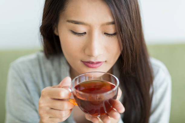 istock Young woman drinking tea 1211948283